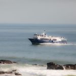 A ferry sails through the peaceful waters near Saint-Hilaire-de-Riez, France.
