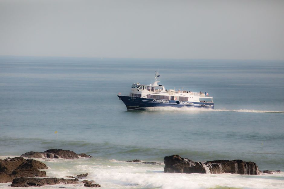 A ferry sails through the peaceful waters near Saint-Hilaire-de-Riez, France.