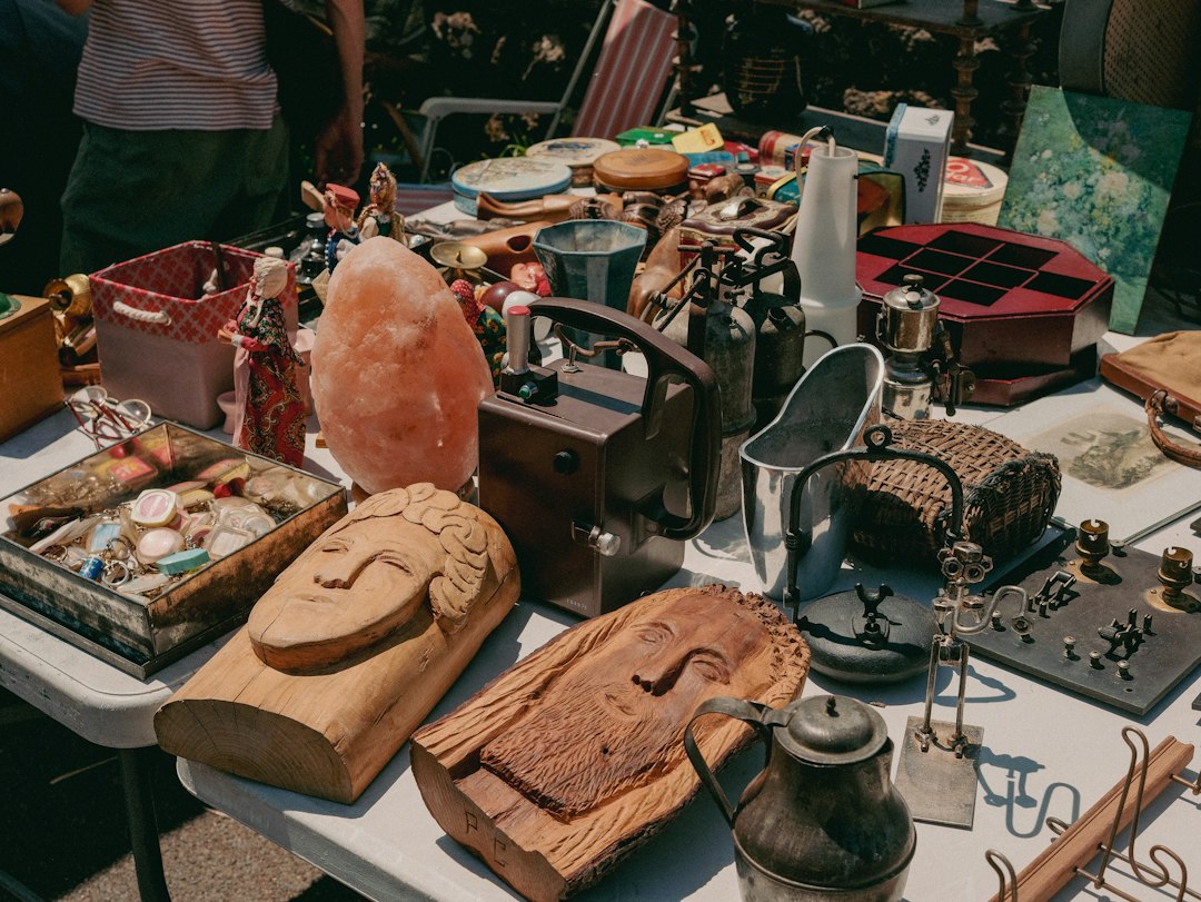 A table full of various items at a flea market