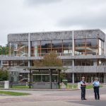 Modern building exterior in Karlsruhe, Germany, with security presence.