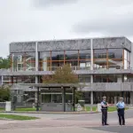 Modern building exterior in Karlsruhe, Germany, with security presence.