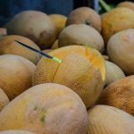 a pile of yellow fruit sitting next to each other